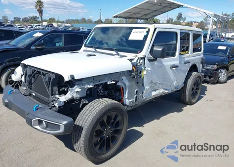 2022 Jeep Wrangler 4Xe Unlimited Sahara 4X4 z USA, uszkodzony, nr VIN 1C4JJXP69NW261068